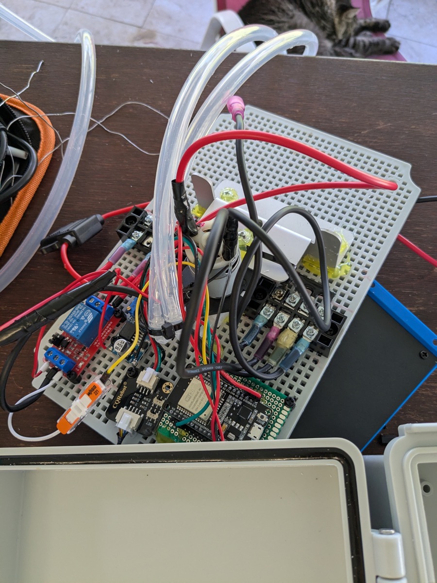 Circuit board assembly with pump motor and tubing