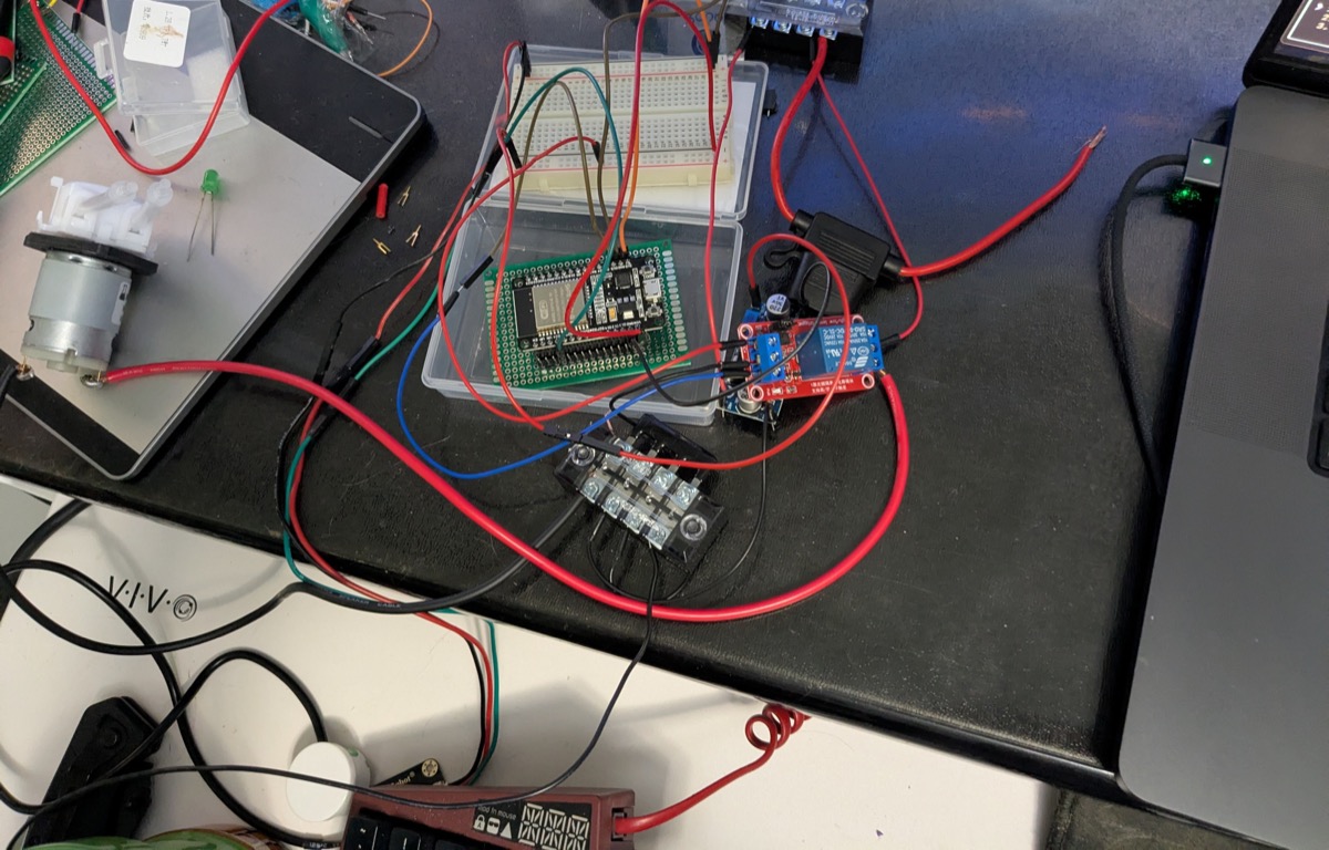 ESP32 wired to relay module and motor